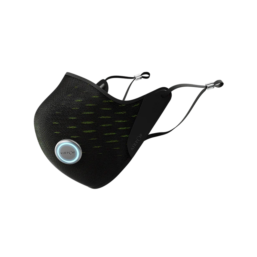 A black and green AirPop Active(+) Smart Mask with a light on it.